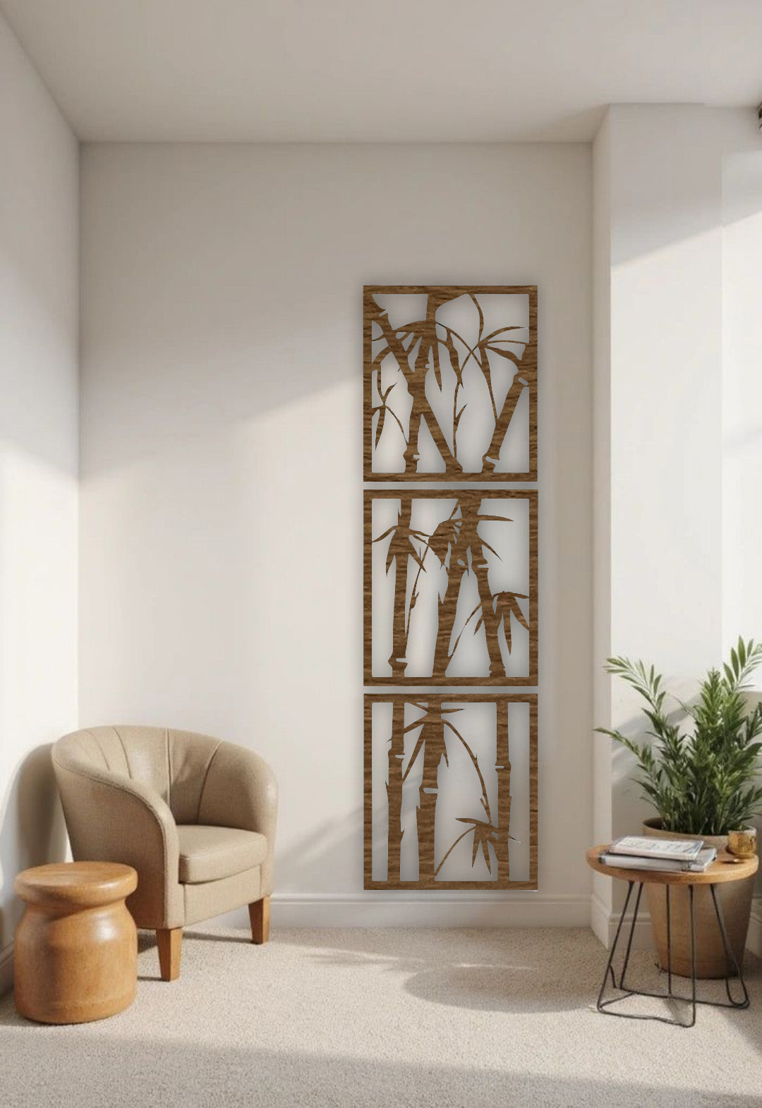 Vertical 3-piece wooden bamboo wall art panels in matte black, mounted on a white wall in a modern reading nook with beige armchair and green indoor plant.
