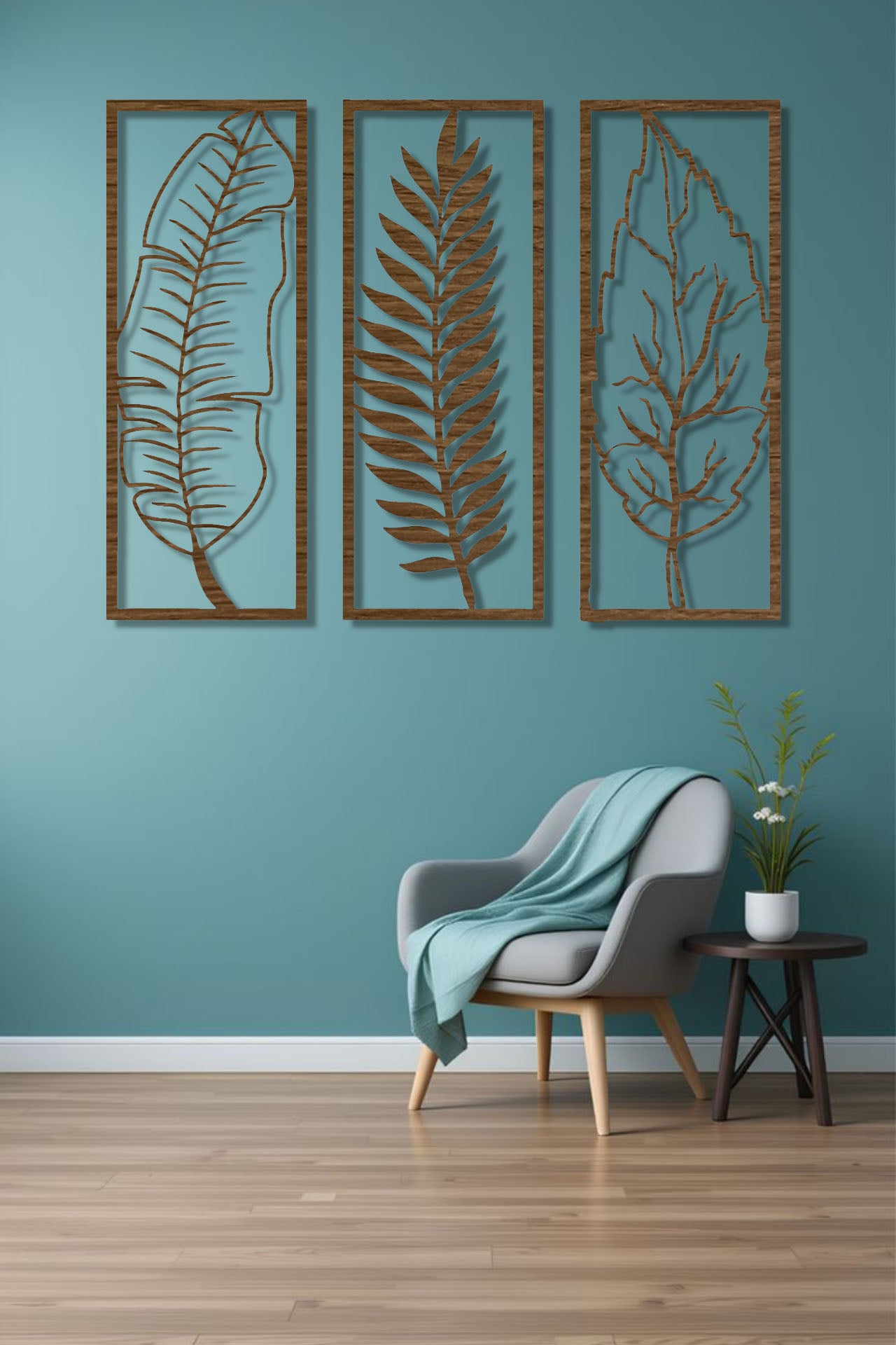 Natural wood brown 3-piece vertical leaf wall art set with botanical designs, displayed in a neutral-toned room beside indoor plants.
