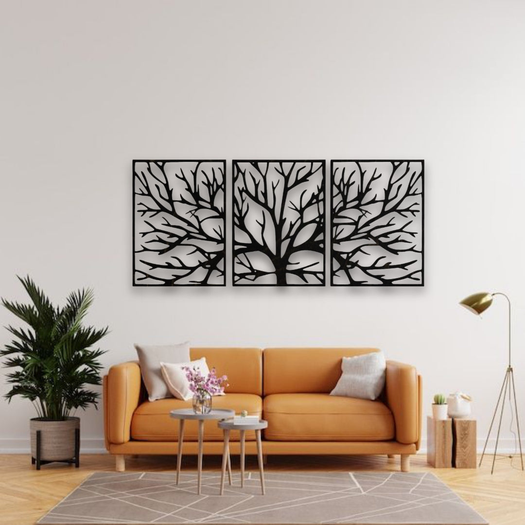 Size comparison of black tree wall art panels in a minimal room, showing medium size at 26x18 inches and large size at 32x22 inches, displayed side by side on a white wall
