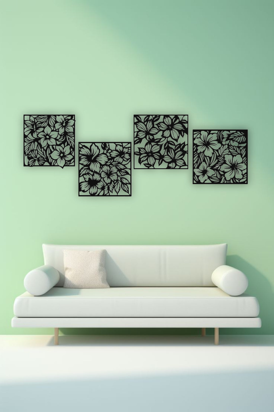 "Modern living room with a white L-shaped sofa and yellow accents, featuring a set of four black wooden laser cut floral wall art panels mounted on a white wall. Each panel displays intricate flower and leaf patterns, arranged in a staggered layout above the couch."