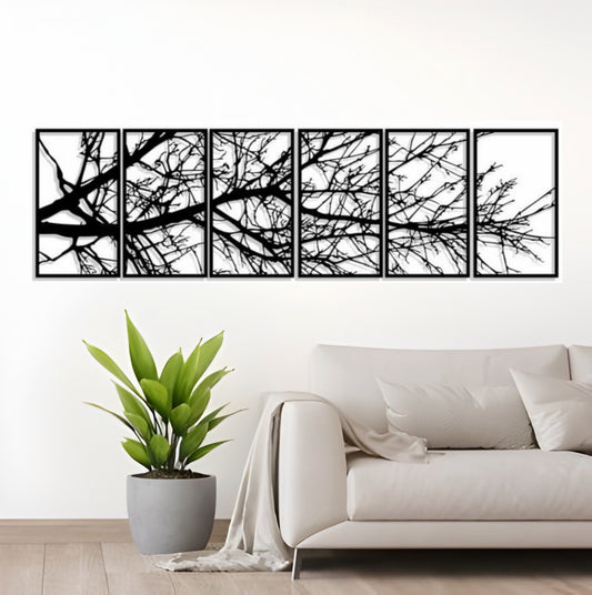 Detailed view of tree branch design in black laser cut wooden wall panels for modern home decor