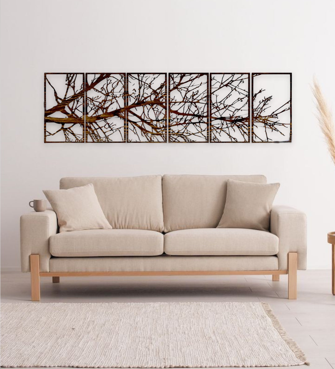 6-panel laser cut wooden wall art featuring abstract tree branches above a modern beige sofa"