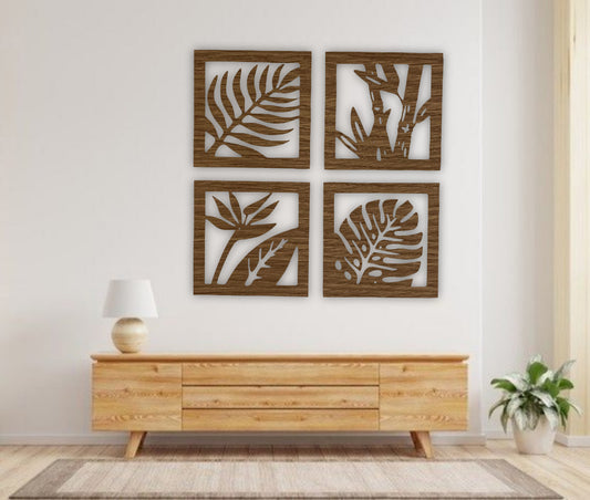 Four-piece square wooden wall art set with tropical leaf and plant designs in black finish, mounted above a modern wooden sideboard