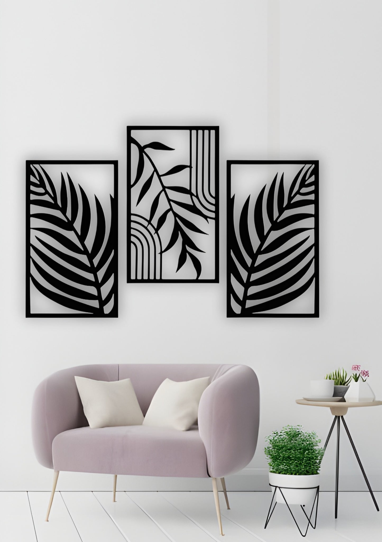 Modern 3-piece black wooden wall art featuring tropical palm leaf patterns, displayed above a light blue sofa in a minimalist grey living room