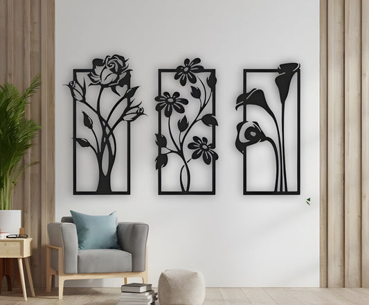 Modern floral-themed wooden wall art set in black finish with three nature-inspired panels mounted in a living space