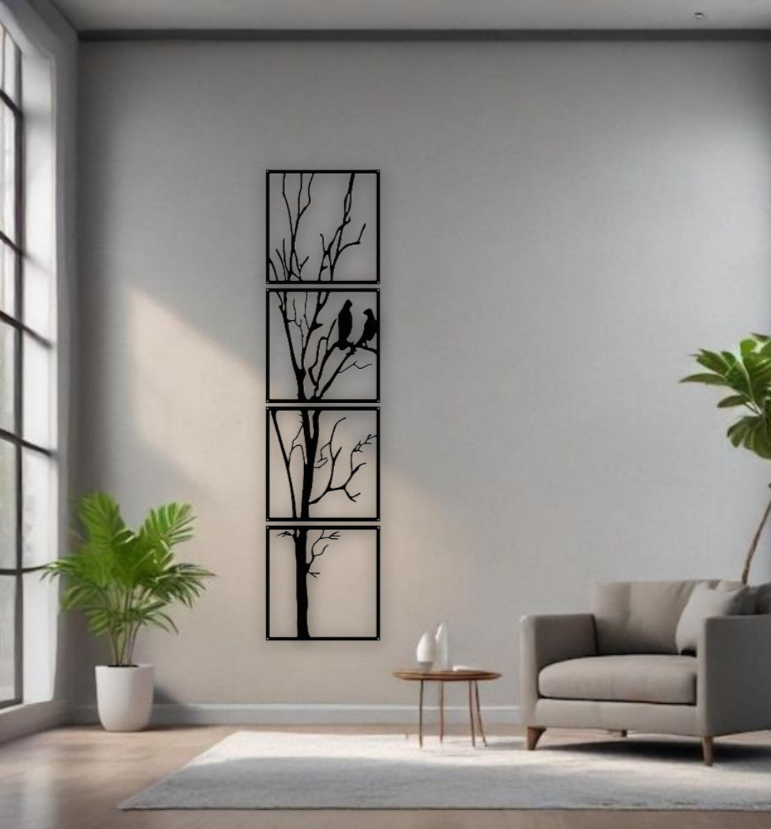 Black 4-panel vertical wooden wall art featuring a tree with two birds, total size 12x50 inches, mounted in a minimalist white interior with natural light and modern decor