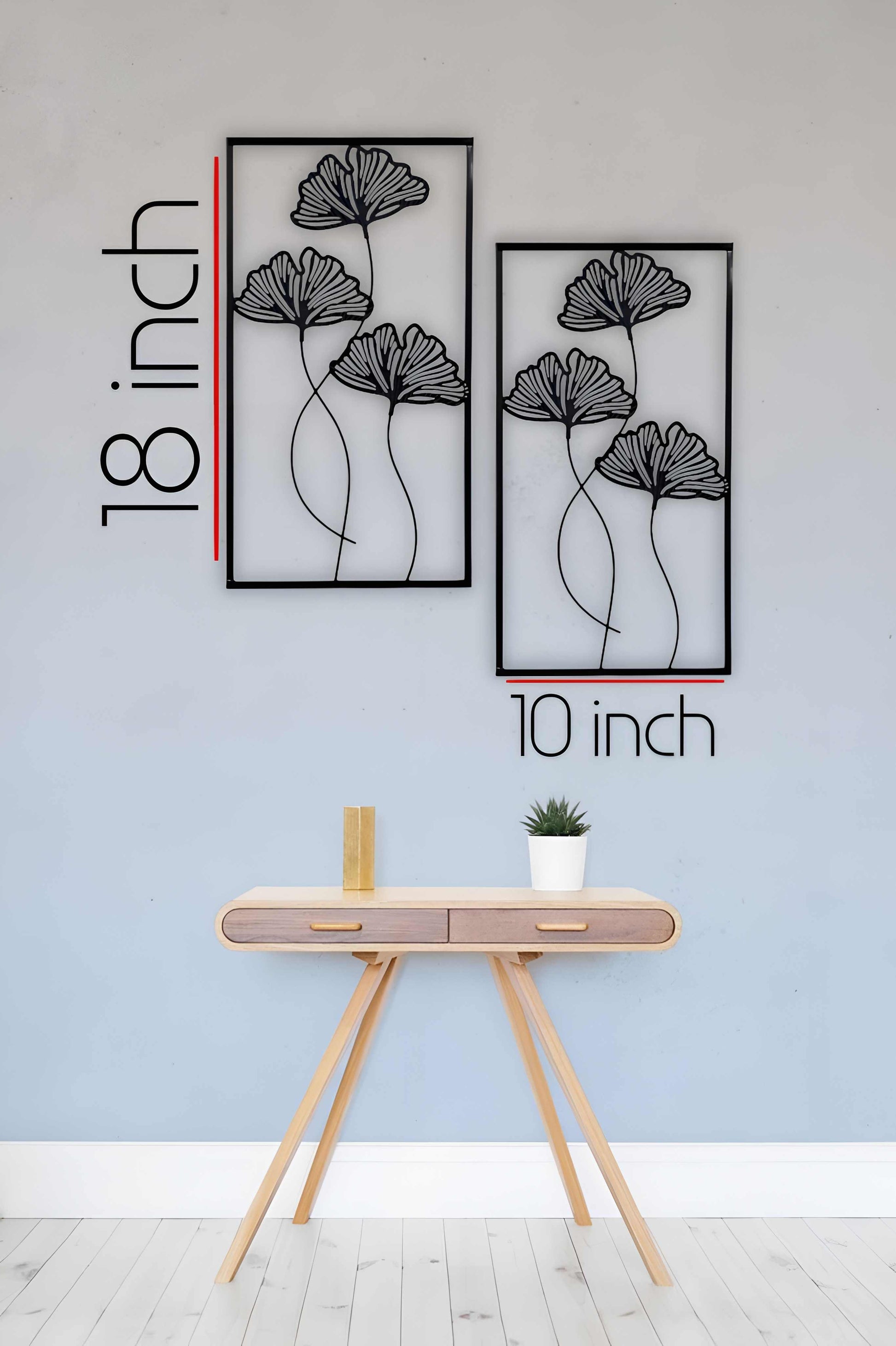 "Minimalist black floral wooden wall art displayed in a modern bright living room"