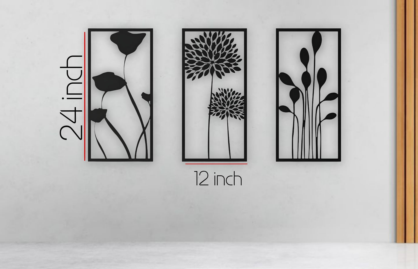 Three-piece botanical wooden wall art set in matte black finish, featuring floral silhouettes framed on a cream wall above a modern seating area with colorful pillows.