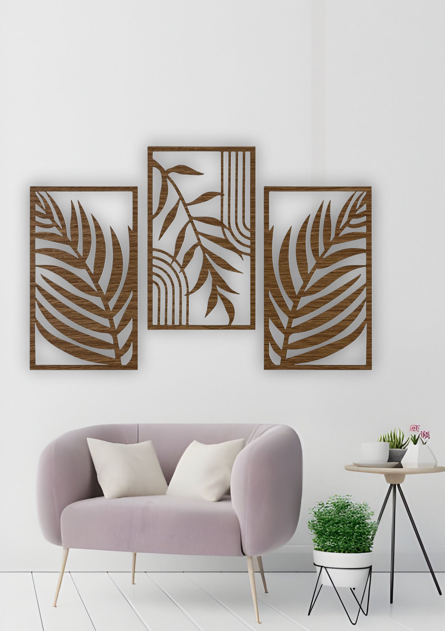 Set of three wood brown wall panels with abstract tropical leaves, mounted in a cozy, modern living room with warm neutral tones