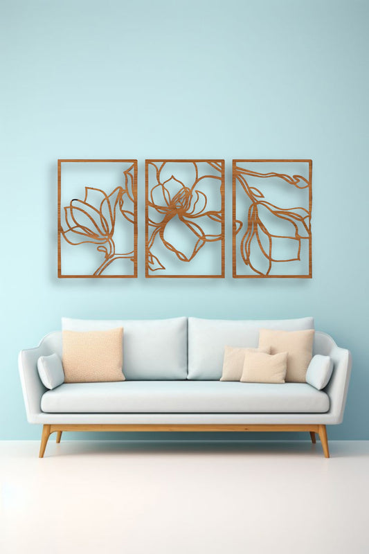 Three-piece floral wooden wall art in matte brown finish mounted above a wooden slatted console table in a modern interior setting
