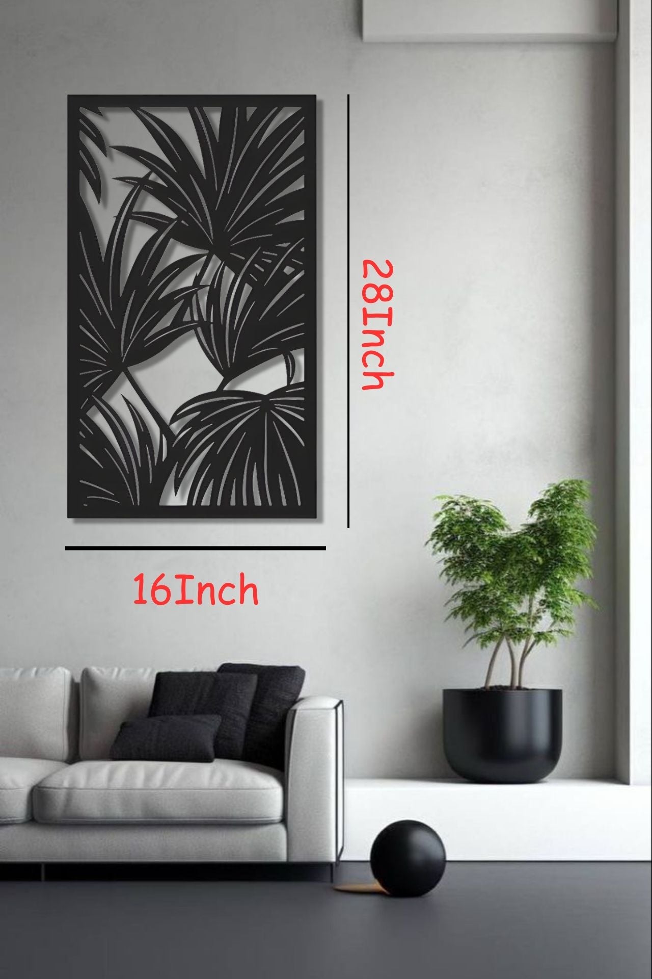 Black tropical leaf wooden wall art panel, 16x28 inches, displayed above a modern cabinet in a minimalist white room with indoor plants and soft lighting