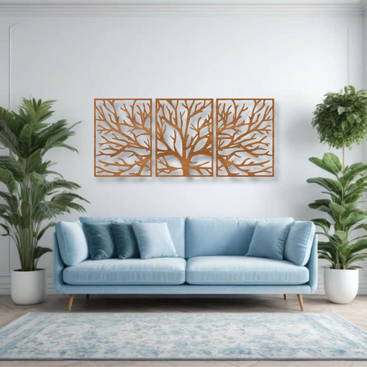 Three-piece wall art featuring a tree silhouette in wood brown finish, mounted above a light blue sofa, surrounded by indoor plants in a modern living room
