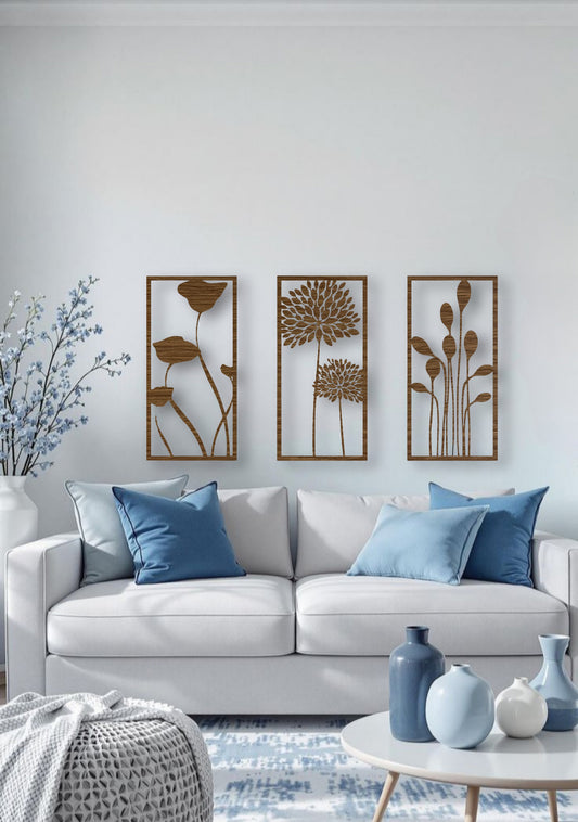 Three-piece botanical wooden wall art set in natural wood brown finish, displaying floral silhouettes on a neutral wall with cozy, modern interior decor.