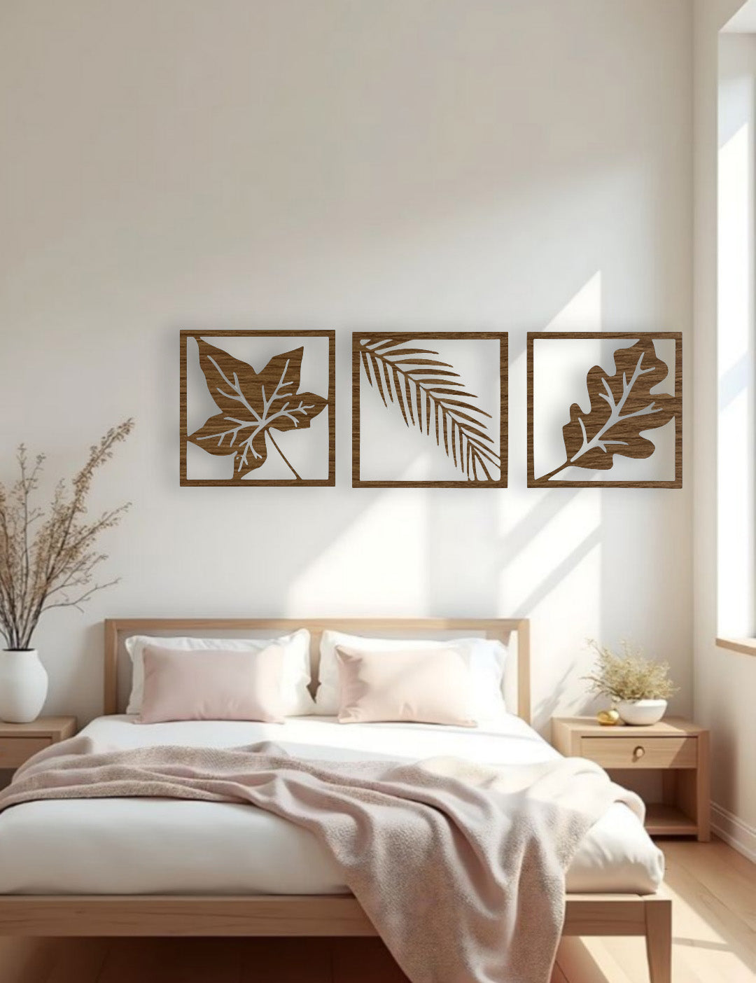 Nature-themed wooden wall art in wood brown finish with three distinct leaf patterns displayed above a bed in a stylish modern room