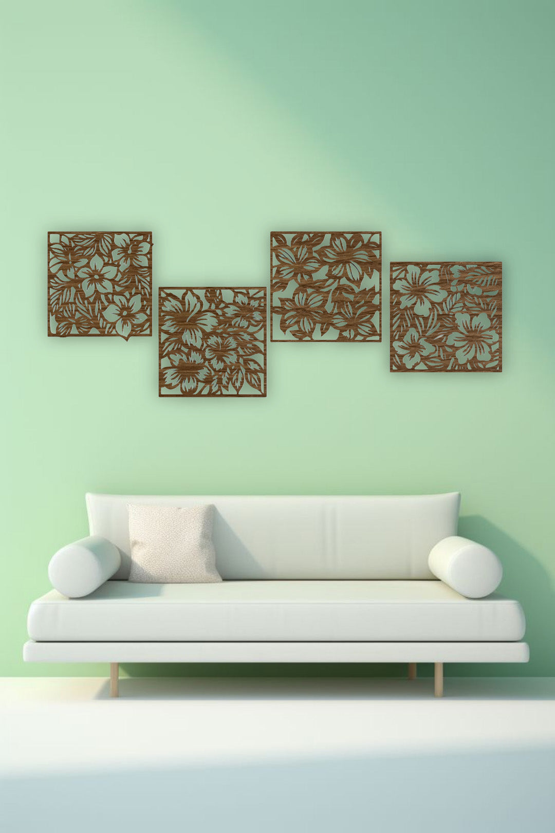 "Modern living room with a white L-shaped sofa and yellow accents, featuring a set of four black wooden laser cut floral wall art panels mounted on a white wall. Each panel displays intricate flower and leaf patterns, arranged in a staggered layout above the couch."