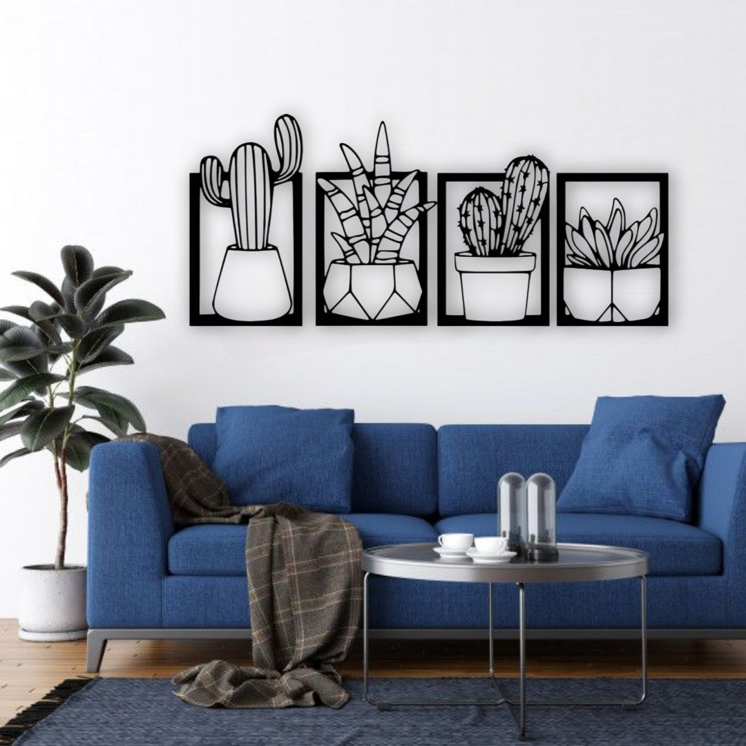 Set of four wooden cactus and succulent wall art panels in black, mounted above a turquoise and wood children’s study desk in a bright, modern kids’ room