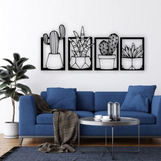 Set of four wooden cactus and succulent wall art panels in black, mounted above a turquoise and wood children’s study desk in a bright, modern kids’ room
