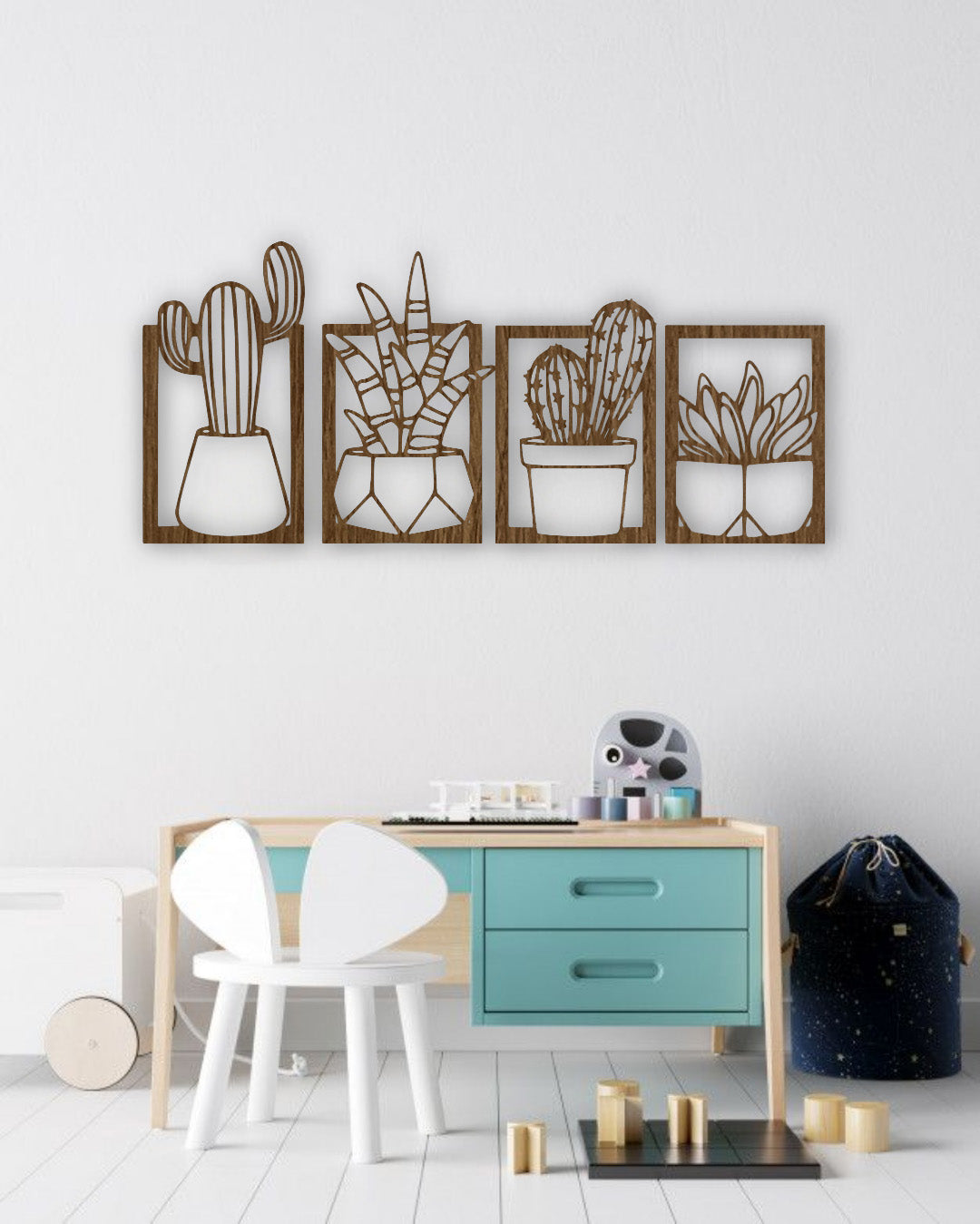 Set of four wooden cactus and succulent wall art panels in wood brown, mounted above a turquoise and wood children’s study desk in a bright, modern kids’ room