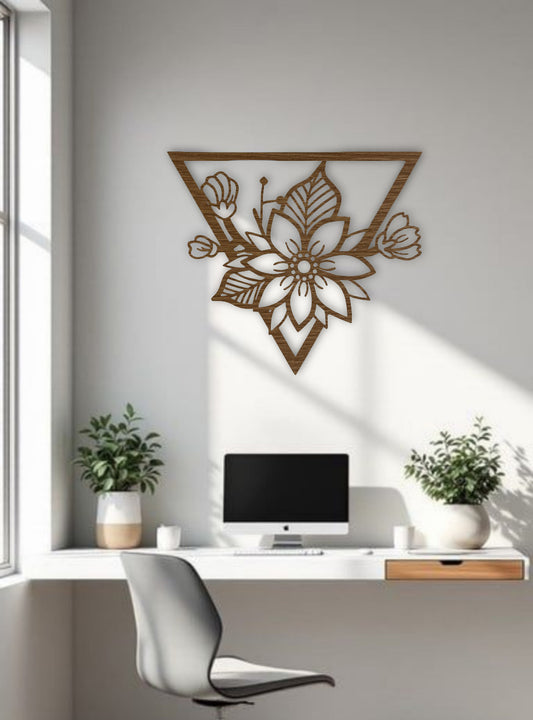 Triangle-shaped floral wooden wall art in natural wood brown finish, styled in a minimal office or workspace interior.