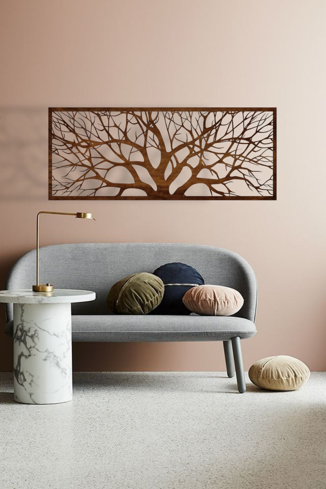 Modern living room with a gray sofa, decorative pillows, a marble side table, and a wall art piece.