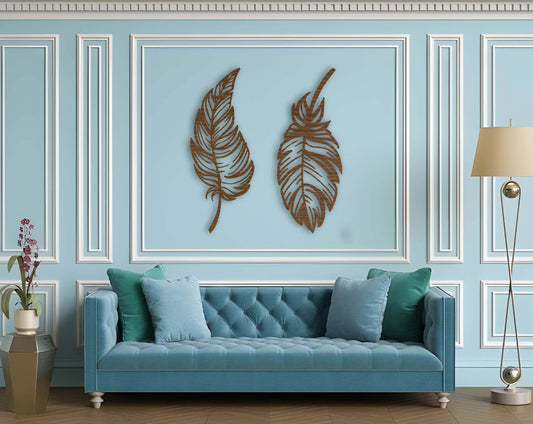Stylish dual-feather wall art in matte brown  finish mounted on a blue paneled wall above a tufted sofa.