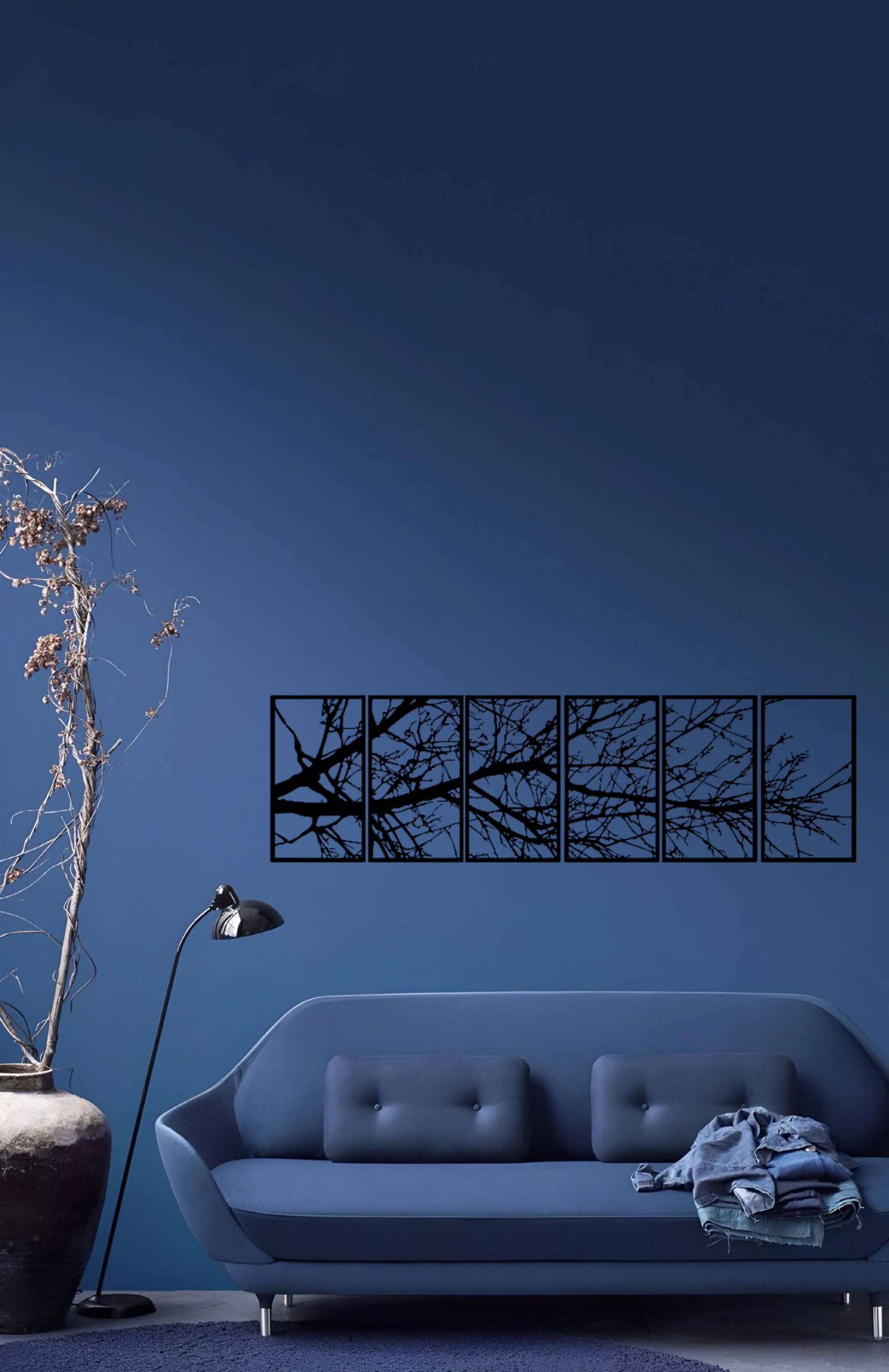 6-panel laser cut wooden wall art featuring abstract tree branches above a modern beige sofa"