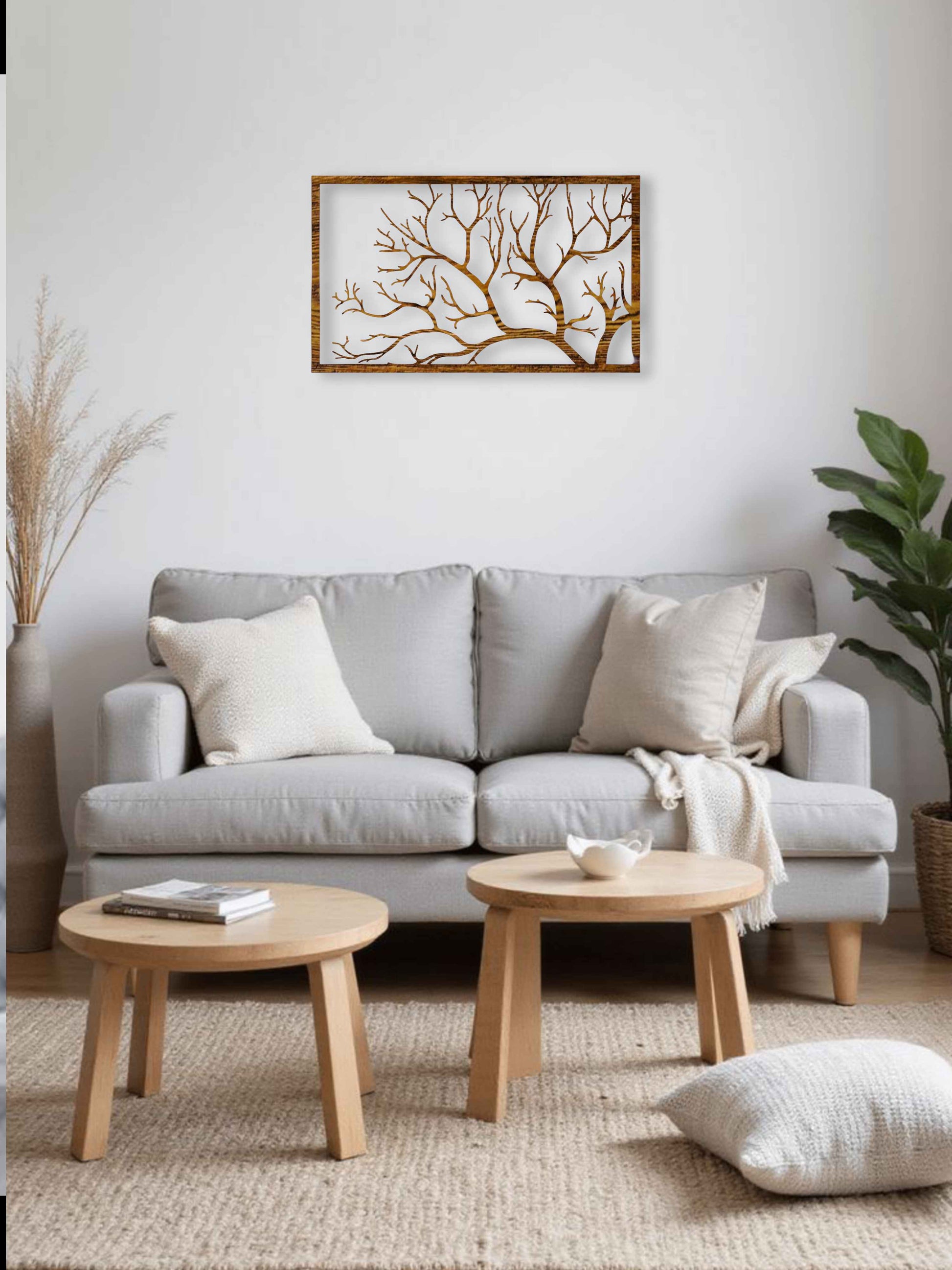 Living room with a gray sofa, wooden coffee tables, and decorative elements.
