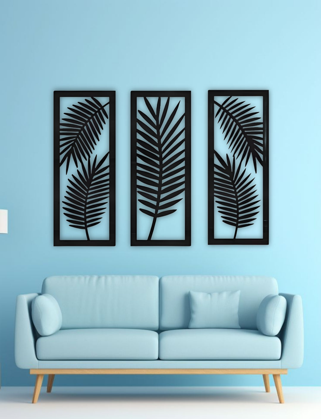 Palm leaf wooden wall panels in black finish displayed in a contemporary living room with a concrete textured background.