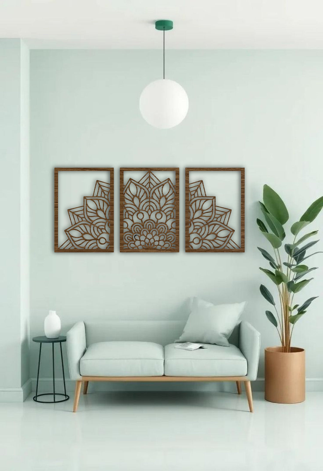 "Three-panel black wooden laser cut mandala wall art displayed above a beige modern sofa in a minimalist living room. Each panel features a symmetrical floral mandala design with clean geometric detailing, creating a balanced and artistic focal point."