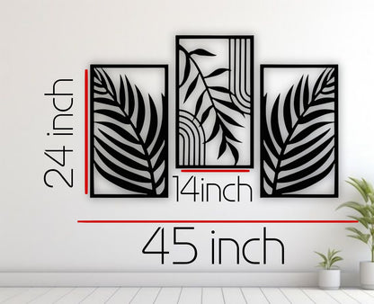 Modern 3-piece black wooden wall art featuring tropical palm leaf patterns, displayed above a light blue sofa in a minimalist grey living room