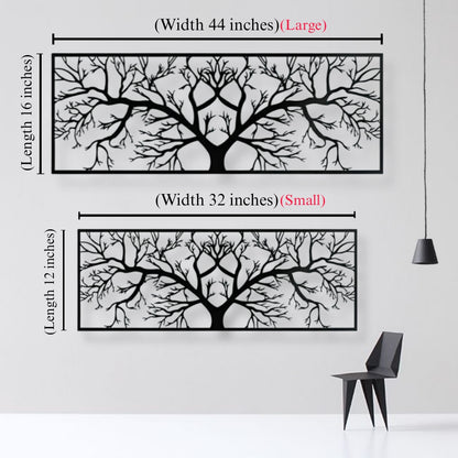 Tree branch wall art with measurements on a white wall.