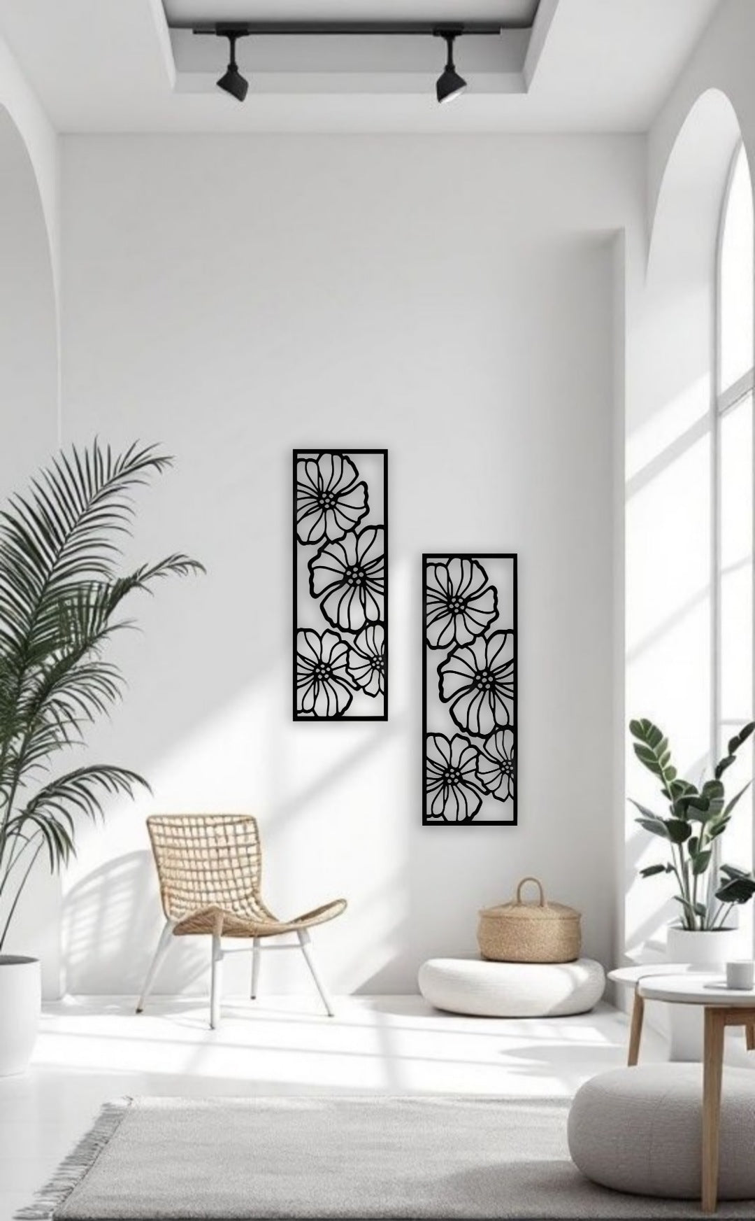 Black floral wooden wall art panel set of 2, measuring 11x30 inches, mounted above a modern light blue sofa in a minimalist living room with monochrome decor.