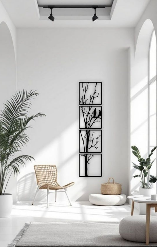Black 4-panel vertical wooden wall art featuring a tree with two birds, total size 12x50 inches, mounted in a minimalist white interior with natural light and modern decor