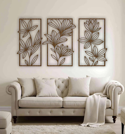 Rustic wood brown floral wall art panels arranged in a set of three, featuring botanical designs on a cream-colored wall above classic furniture