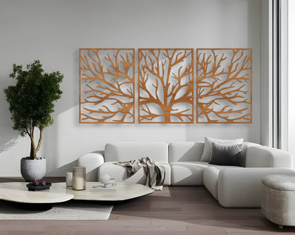 Three-piece wall art featuring a tree silhouette in wood brown finish, mounted above a light blue sofa, surrounded by indoor plants in a modern living room
