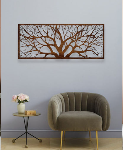 Decorative wall art with tree design above a modern armchair and side table.