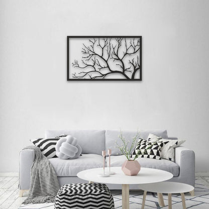 Living room with a gray sofa, decorative pillows, a coffee table, and a framed black and white artwork on the wall.